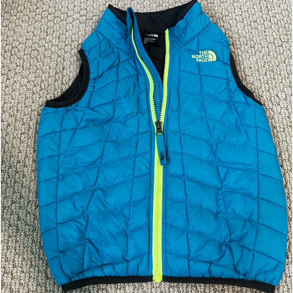North face kids blue zip up puffer vest.